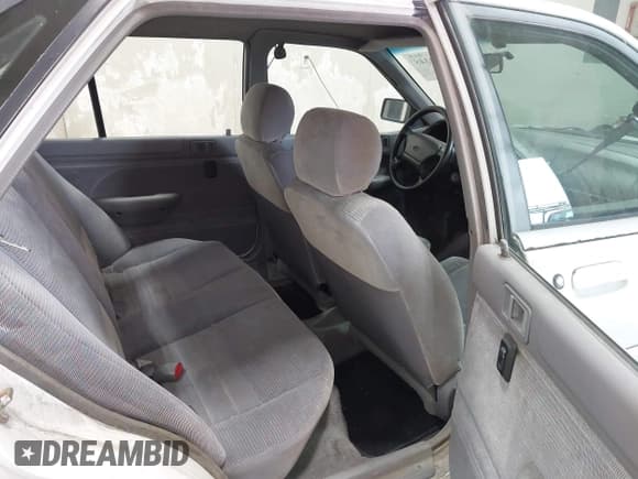 ✅ 1995 Ford Escort • VIN: 1FASP14J2SW297016 • Lot: 42579348. Listed on IAAI with 101,941 mi. Free auction sales archive from the USA and detailed vehicle history report at DreamBid. Image 8.