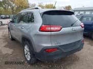 ✅ 2014 Jeep Cherokee Latitude • VIN: 1C4PJLCS0EW101599 • Lot: 43559434. Listed on IAAI with 129,767 mi. Free auction sales archive from the USA and detailed vehicle history report at DreamBid. Image 3.