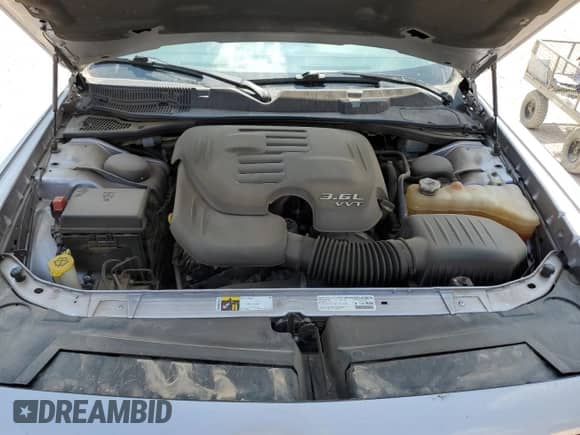 2014 Dodge Challenger SXT z VIN 2C3CDYAG7EH231853, wystawiony jako Copart lot #57032924 z przebiegiem 160 093 mil mil oraz Szkoda całkowita • Salvage title. Historia ofert i sprzedaży dostępna na DreamBid. Obrazek 11.