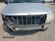 ✅ 2004 Jeep Grand Cherokee Laredo • VIN: 1J4GX48S74C165095 • Lot: 42306475. Listed on IAAI with 238,560 mi. Free auction sales archive from the USA and detailed vehicle history report at DreamBid. Image 14.