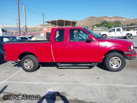 ✅ 2003 Ford F-150 XL • VIN: 2FTRX17213CA25521 • Lot: 42673697. Wystawiony na IAAI z przebiegiem 217 883 mil. Bezpłatny archiwum sprzedaży aukcyjnych z USA i szczegółowy raport historii pojazdu na DreamBid. Zdjęcie 13.