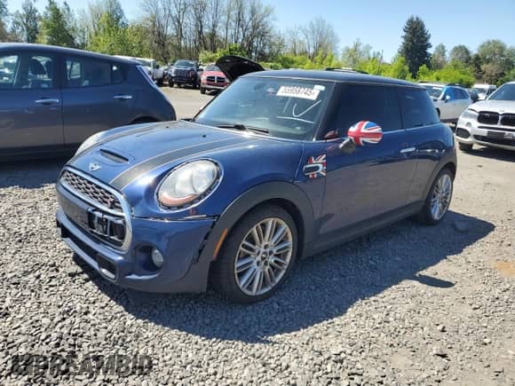 2014 MINI Hardtop S with VIN WMWXM7C51ET926090, listed as a Copart auction lot 55958745 with 148,997 mi miles and Salvage title. Bid and sale history available at DreamBid. Image 1.
