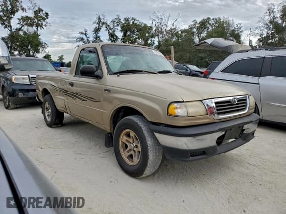 ✅ 1999 Mazda B-Series SX • VIN: 4F4YR12C7XTM22336 • Lot: 93998875. Listed on Copart with 304,120 mi. Free auction sales archive from the USA and detailed vehicle history report at DreamBid. Image 4.