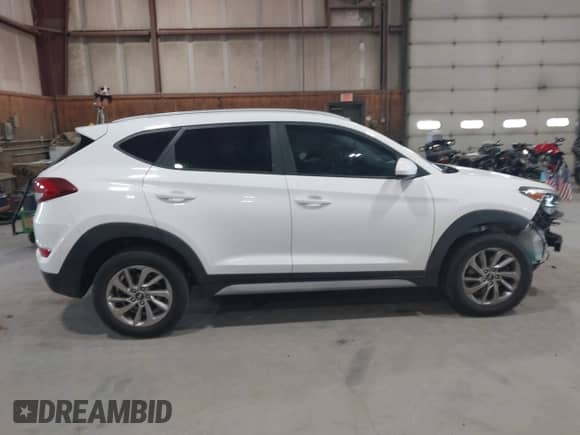 2017 Hyundai Tucson SE z VIN KM8J33A48HU404856, wystawiony jako IAAI lot #43225561 z przebiegiem 53 542 mil mil oraz . Historia ofert i sprzedaży dostępna na DreamBid. Obrazek 13.