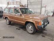 ✅ 1985 Jeep Grand Wagoneer • VIN: 1JCWC7567FT079177 • Lot: 43743736. Listed on IAAI with 132,950 mi. Free auction sales archive from the USA and detailed vehicle history report at DreamBid. Image 1.