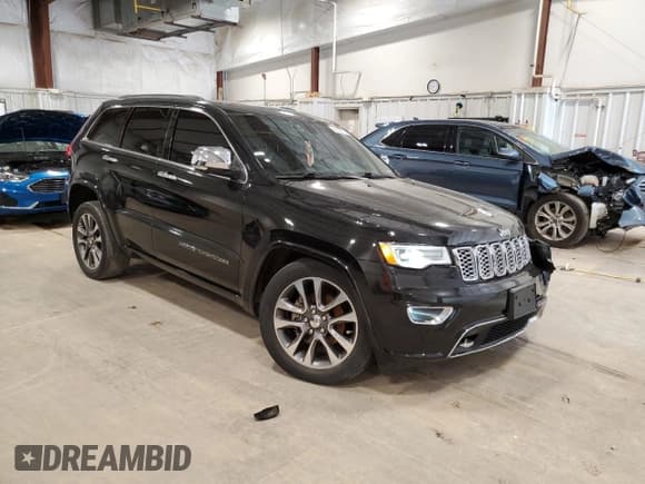 ✅ 2018 Jeep Grand Cherokee Overland • VIN: 1C4RJECG0JC428581 • Лот: 64009575. Опубликован ранее на Copart с пробегом 130 337 миль. Бесплатный доступ к архиву аукционных продаж из США и подробный отчёт об истории автомобиля на DreamBid. Изображение 4.