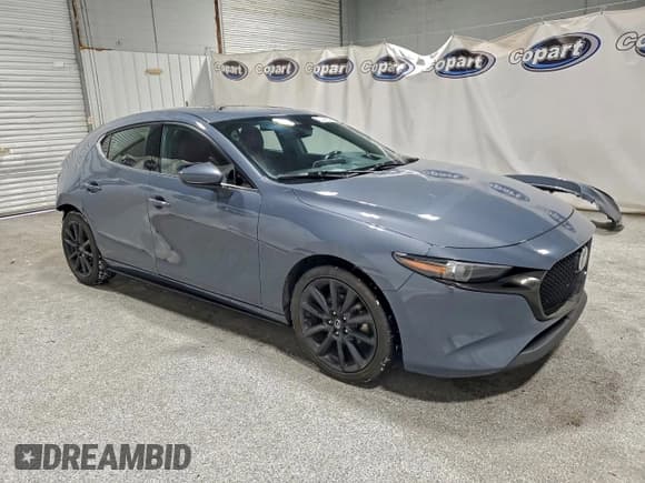 ✅ 2022 Mazda 3 Premium • VIN: JM1BPAML5N1520887 • Lot: 94921415. Listed on Copart with 69,877 mi. Free auction sales archive from the USA and detailed vehicle history report at DreamBid. Image 4.