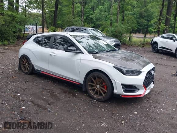 2020 Hyundai Veloster z VIN KMHT36AHXLU003718, wystawiony jako IAAI lot #42331507 z przebiegiem 82 020 mil mil oraz . Historia ofert i sprzedaży dostępna na DreamBid. Obrazek 1.