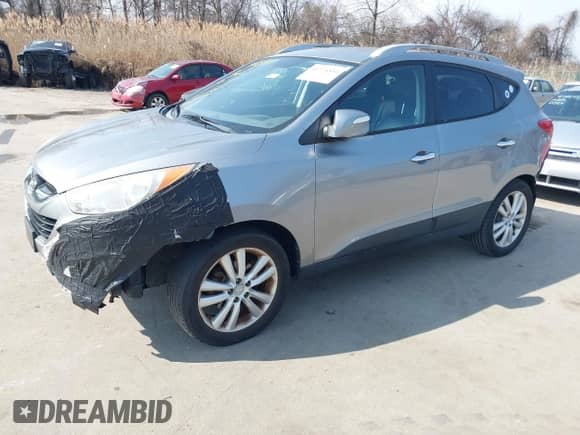 2010 Hyundai Tucson GLS with VIN KM8JUCAC2AU078658, listed as a IAAI auction lot 41726534 with 140,155 mi miles and . Bid and sale history available at DreamBid. Image 2.