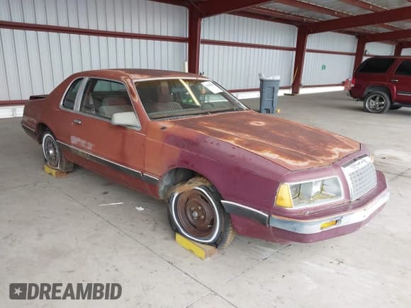 ✅ 1984 Ford Thunderbird • VIN: 1FABP4630EA111572 • Lot: 41569309. Listed on IAAI with 7,919 mi. Free auction sales archive from the USA and detailed vehicle history report at DreamBid. Image 1.