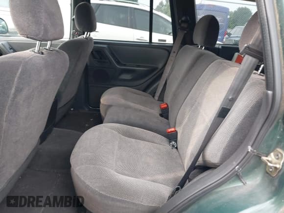 ✅ 1999 Jeep Grand Cherokee Laredo • VIN: 1J4G258S5XC543617 • Lot: 39937200. Listed on IAAI with 133,461 mi. Free auction sales archive from the USA and detailed vehicle history report at DreamBid. Image 8.