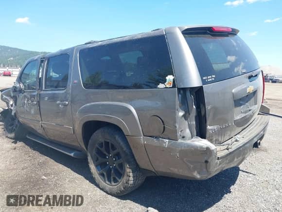 2014 Chevrolet Suburban LT with VIN 1GNSKJE79ER175422, listed as a IAAI auction lot 42654533 with 87,101 mi miles and . Bid and sale history available at DreamBid. Image 3.