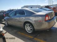 ✅ 2012 Chevrolet Malibu LTZ • VIN: 1G1ZG5E74CF281946 • Lot: 49991684. Listed on Copart with 152,608 mi. Free auction sales archive from the USA and detailed vehicle history report at DreamBid. Image 2.