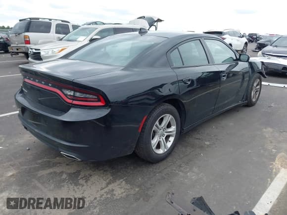 ✅ 2023 Dodge Charger SXT • VIN: 2C3CDXBG5PH579520 • Lot: 43245472. Listed on IAAI with 59,873 mi. Free auction sales archive from the USA and detailed vehicle history report at DreamBid. Image 4.
