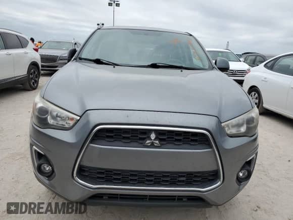 2015 Mitsubishi Outlander ES z VIN 4A4AP3AU7FE061451, wystawiony jako Copart lot #76810584 z przebiegiem 98 692 mil mil oraz Szkoda całkowita • Salvage title. Historia ofert i sprzedaży dostępna na DreamBid. Obrazek 5.