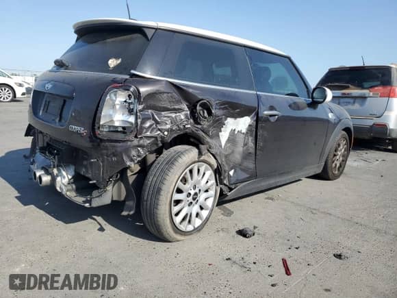 2014 MINI Hardtop S with VIN WMWXM7C59ET987820, listed as a Copart auction lot 59164955 with 77,699 mi miles and Salvage title. Bid and sale history available at DreamBid. Image 3.