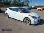 2012 Hyundai Veloster w/Red Int with VIN KMHTC6AD6CU028161, listed as a IAAI auction lot 43564329 with 98,673 mi miles and . Bid and sale history available at DreamBid. Image 1.