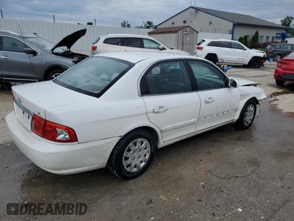 ✅ 2003 Kia Optima LX • VIN: KNAGD126335210008 • Lot: 67408705. Listed on Copart with 212,574 mi. Free auction sales archive from the USA and detailed vehicle history report at DreamBid. Image 3.