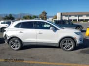 ✅ 2015 Lincoln MKC • VIN: 5LMTJ2AH6FUJ13553 • Lot: 43585464. Listed on IAAI with 136,864 mi. Free auction sales archive from the USA and detailed vehicle history report at DreamBid. Image 14.