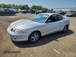 2001 Hyundai Tiburon с VIN KMHJG25FX1U237982, выставлен на аукционе Copart как лот 65774595 с пробегом 125 241 миль миль и Списание • Salvage title. История ставок и продаж доступна на DreamBid. Изображение 1.