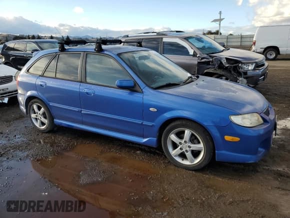 ✅ 2003 Mazda Protege • VIN: JM1BJ245431193789 • Lot: 78711424. Wystawiony na Copart z przebiegiem 135 067 mil. Bezpłatny archiwum sprzedaży aukcyjnych z USA i szczegółowy raport historii pojazdu na DreamBid. Zdjęcie 4.