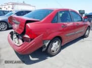 ✅ 2003 Ford Focus LX • VIN: 1FAFP33PX3W241880 • Lot: 42564941. Wystawiony na IAAI z przebiegiem 99 468 mil. Bezpłatny archiwum sprzedaży aukcyjnych z USA i szczegółowy raport historii pojazdu na DreamBid. Zdjęcie 4.