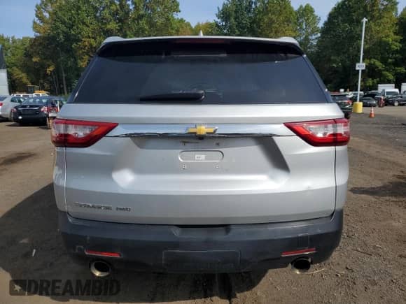 2018 Chevrolet Traverse LS with VIN 1GNEVFKW2JJ205348, listed as a Copart auction lot 84014945 with 104,111 mi miles and Salvage title. Bid and sale history available at DreamBid. Image 6.
