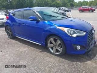 2013 Hyundai Veloster Turbo z VIN KMHTC6AE2DU163910, wystawiony jako IAAI lot #42880099 z przebiegiem 244 002 mil mil oraz . Historia ofert i sprzedaży dostępna na DreamBid. Obrazek 1.
