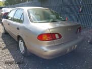 ✅ 1999 Toyota Corolla VE • VIN: 2T1BR12E1XC141396 • Lot: 42969365. Listed on IAAI with 215,831 mi. Free auction sales archive from the USA and detailed vehicle history report at DreamBid. Image 3.