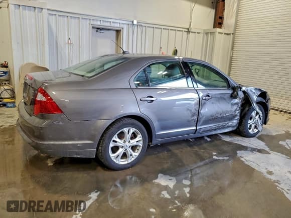 ✅ 2012 Ford Fusion SE • VIN: 3FAHP0HA9CR281396 • Lot: 94140105. Wystawiony na Copart z przebiegiem 171 151 mil. Bezpłatny archiwum sprzedaży aukcyjnych z USA i szczegółowy raport historii pojazdu na DreamBid. Zdjęcie 3.