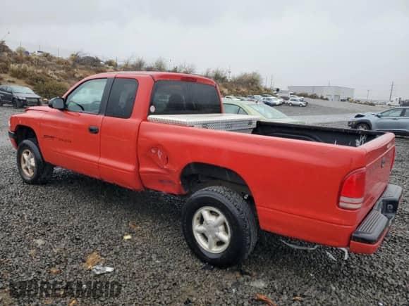 1998 Dodge Dakota SLT z VIN 1B7GG22X1WS598712, wystawiony jako Copart lot #76095004 z przebiegiem 196 012 mil mil oraz Szkoda całkowita • Salvage title. Historia ofert i sprzedaży dostępna na DreamBid. Obrazek 2.