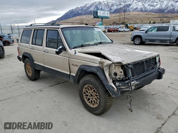 ✅ 1995 Jeep Cherokee Country • VIN: 1J4FJ78S1SL501335 • Lot: 95866195. Listed on Copart with 218,317 mi. Free auction sales archive from the USA and detailed vehicle history report at DreamBid. Image 4.