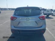 ✅ 2016 Mazda CX-5 Sport • VIN: JM3KE2BY4G0845816 • Lot: 42333248. Listed on IAAI with 48,504 mi. Free auction sales archive from the USA and detailed vehicle history report at DreamBid. Image 16.