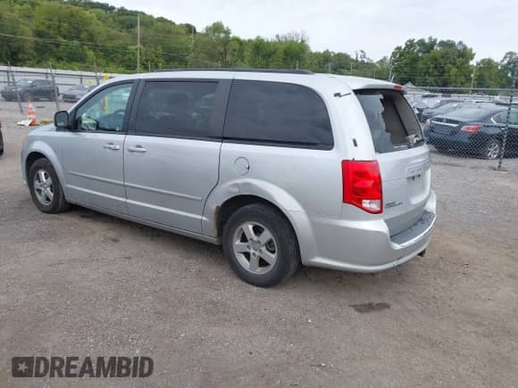 2012 Dodge Grand Caravan SXT z VIN 2C4RDGCG1CR197431, wystawiony jako IAAI lot #43273747 z przebiegiem 243 376 mil mil oraz . Historia ofert i sprzedaży dostępna na DreamBid. Obrazek 3.