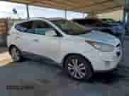 2012 Hyundai Tucson Limited with VIN KM8JUCAC1CU519960, listed as a Copart auction lot 67451415 with 222,008 mi miles and Salvage title. Bid and sale history available at DreamBid. Image 4.