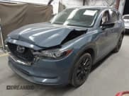 ✅ 2021 Mazda CX-5 Carbon Edition • VIN: JM3KFACY1M0384463 • Lot: 42302688. Listed on IAAI with 65,788 mi. Free auction sales archive from the USA and detailed vehicle history report at DreamBid. Image 2.
