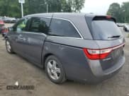 ✅ 2013 Honda Odyssey Touring • VIN: 5FNRL5H96DB054487 • Лот: 68446335. Опубликован ранее на Copart с пробегом 168 649 миль. Бесплатный доступ к архиву аукционных продаж из США и подробный отчёт об истории автомобиля на DreamBid. Изображение 2.