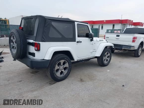 ✅ 2018 Jeep Wrangler Sahara • VIN: 1C4AJWBG1JL809098 • Lot: 42875034. Listed on IAAI with 24,297 mi. Free auction sales archive from the USA and detailed vehicle history report at DreamBid. Image 4.