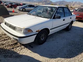 ✅ 1992 Toyota Corolla • VIN: JT2AE94A1N0300157 • Lot: 77783474. Listed on Copart with 180,103 mi. Free auction sales archive from the USA and detailed vehicle history report at DreamBid. Image 1.