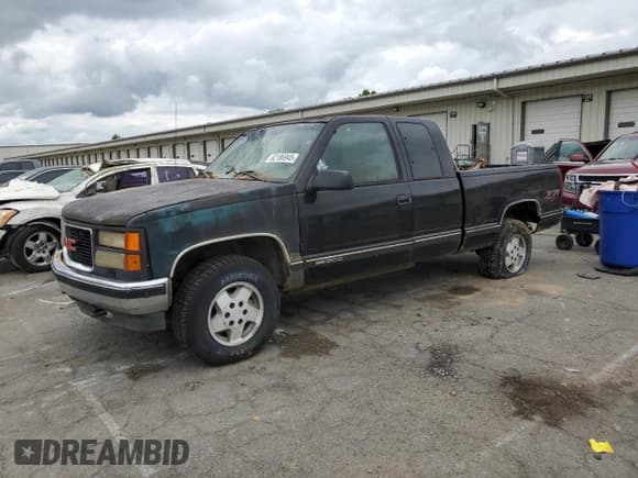 ✅ 1998 GMC Sierra 1500 • VIN: 1GTEK19R2WE559262 • Лот: 62186945. Опубликован ранее на Copart с пробегом 217 981 миль. Бесплатный доступ к архиву аукционных продаж из США и подробный отчёт об истории автомобиля на DreamBid. Изображение 1.