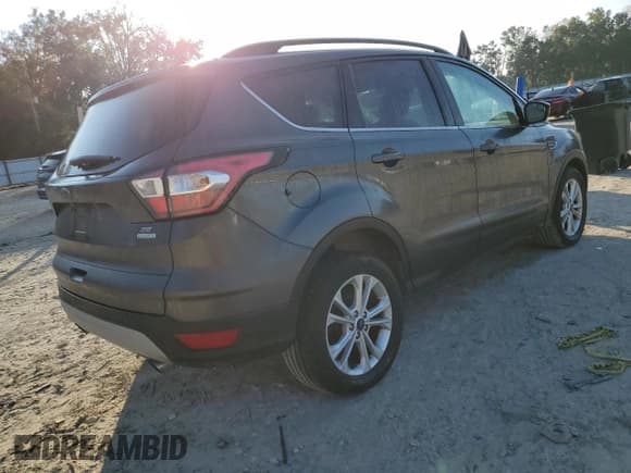 ✅ 2018 Ford Escape SE • VIN: 1FMCU0GD7JUC27721 • Lot: 93012415. Listed on Copart with 144,625 mi. Free auction sales archive from the USA and detailed vehicle history report at DreamBid. Image 3.
