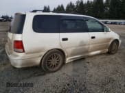 ✅ 1998 Honda Odyssey • VIN: RA31038664 • Lot: 43051785. Listed on Copart with 106,084 mi. Free auction sales archive from the USA and detailed vehicle history report at DreamBid. Image 3.