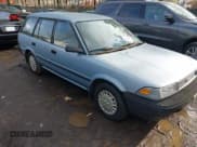 ✅ 1990 Toyota Corolla • VIN: JT2AE94K5L3375304 • Lot: 43883185. Listed on IAAI with 181,744 mi. Free auction sales archive from the USA and detailed vehicle history report at DreamBid. Image 1.