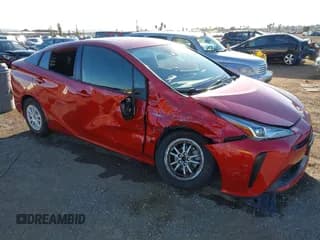 ✅ 2021 Toyota Prius L Eco • VIN: JTDKAMFU2M3145620 • Лот: 43433084. Опубликован ранее на IAAI с пробегом 78 100 миль. Бесплатный доступ к архиву аукционных продаж из США и подробный отчёт об истории автомобиля на DreamBid. Изображение 1.