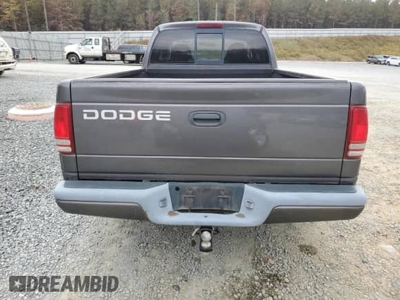 2002 Dodge Dakota z VIN 1B7GL12X22S589971, wystawiony jako Copart lot #79740174 z przebiegiem 183 718 mil mil oraz Czysty tytuł • Clean title. Historia ofert i sprzedaży dostępna na DreamBid. Obrazek 6.