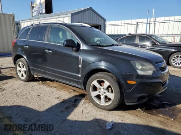 2015 Chevrolet Captiva Sport LT z VIN 3GNAL3EK4FS511548, wystawiony jako Copart lot #84188124 z przebiegiem 275 071 mil mil oraz Czysty tytuł • Clean title. Historia ofert i sprzedaży dostępna na DreamBid. Obrazek 4.