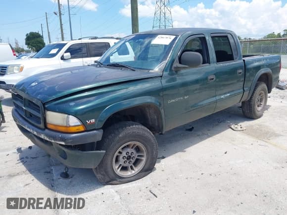 ✅ 2000 Dodge Dakota Sport • VIN: 1B7GG2AN4YS641376 • Lot: 42867876. Wystawiony na IAAI z przebiegiem 282 598 mil. Bezpłatny archiwum sprzedaży aukcyjnych z USA i szczegółowy raport historii pojazdu na DreamBid. Zdjęcie 2.