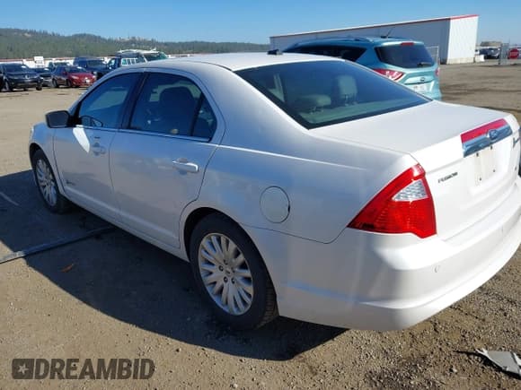 ✅ 2012 Ford Fusion Hybrid • VIN: 3FADP0L36CR414428 • Lot: 43462972. Listed on IAAI with 198,121 mi. Free auction sales archive from the USA and detailed vehicle history report at DreamBid. Image 3.