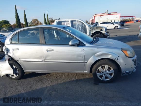 ✅ 2010 Kia Rio LX • VIN: KNADH4A38A6673706 • Lot: 43645629. Listed on IAAI with 145,094 mi. Free auction sales archive from the USA and detailed vehicle history report at DreamBid. Image 13.