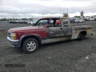 1995 Dodge Dakota z VIN 1B7GL23X6SS144198, wystawiony jako Copart lot #57501855 z przebiegiem Nie podano mil oraz Szkoda całkowita • Salvage title. Historia ofert i sprzedaży dostępna na DreamBid. Obrazek 1.